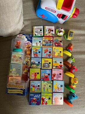 Little tikes story dream machine with tons of stories.